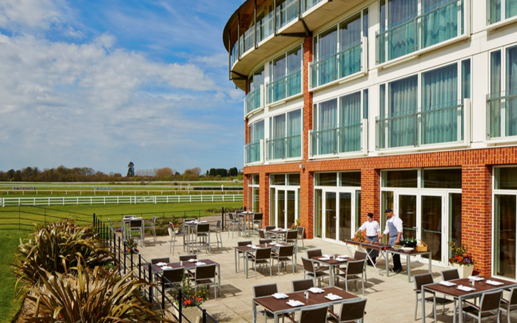 The restaurant patio and hotel exterior of Lingfield Park Hotel